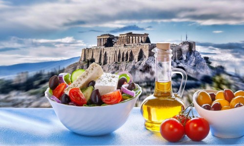 Famous Acropolis with Greek salad in Athens, Greece